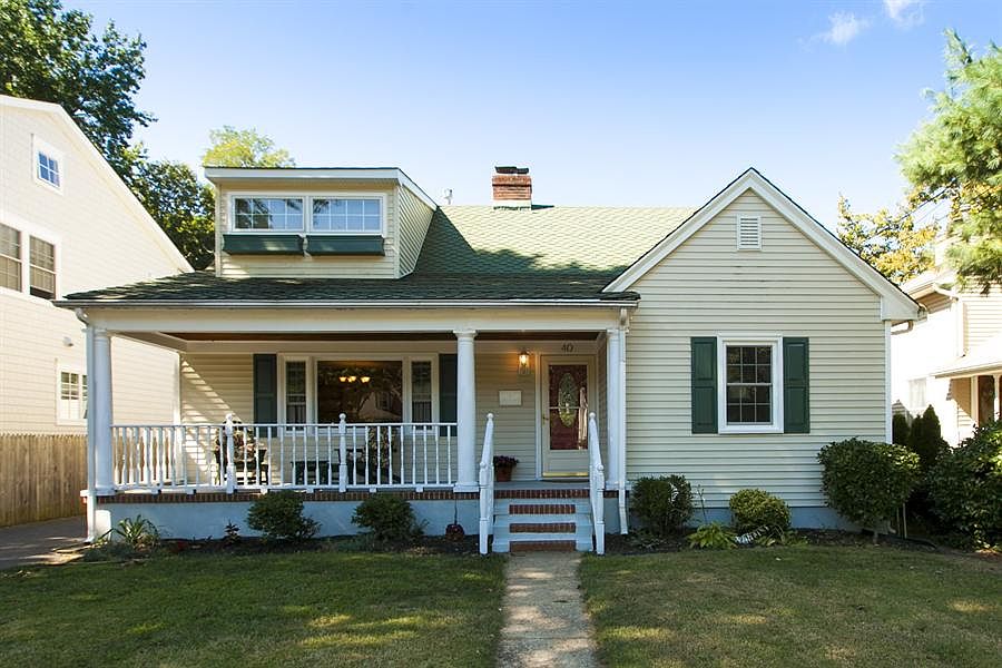 )This great cape cod is located on a great street and large lot in the heart o