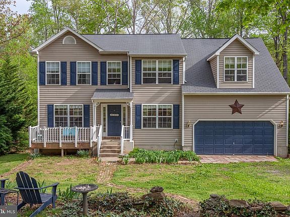 Over an acre of property w/ the lake a block away.