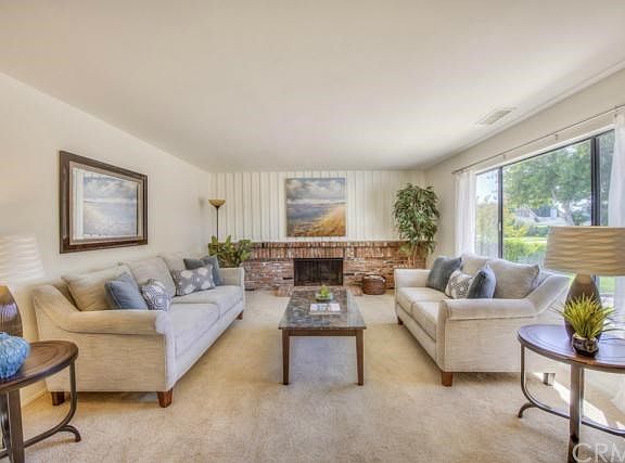 Spacious Living Room with Brick Fireplace