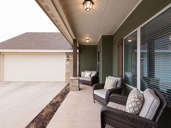 Spacious oversized porch is shaded throughout the day!