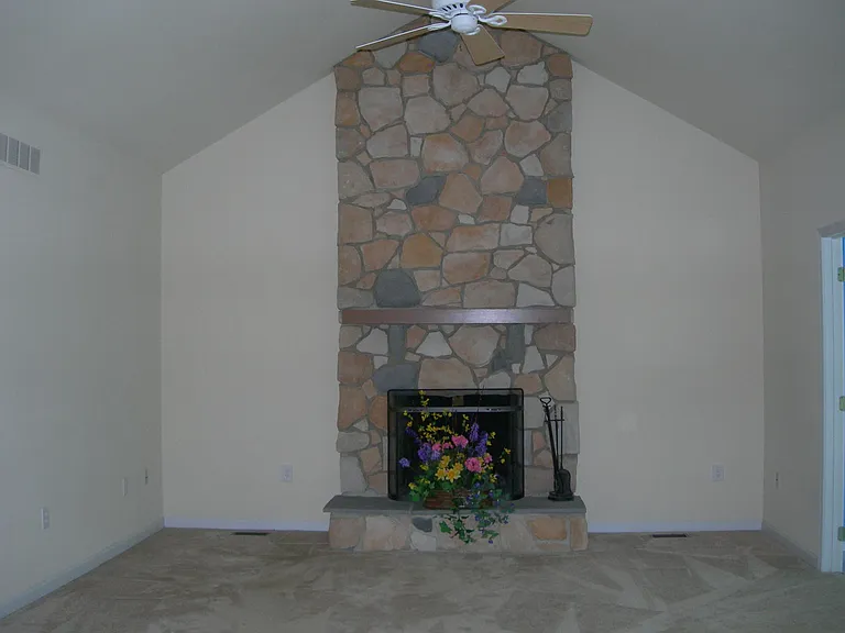 Family Room with Wood Burning Fireplace and Cathedral ceiling