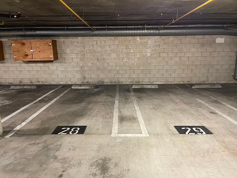 Two (#28 ) reserved subterranean parking spots