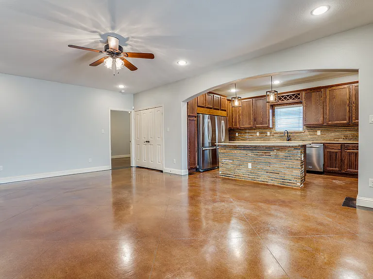 2714 Merida. Duplex home near TCU. Living room and kitchen open with island.