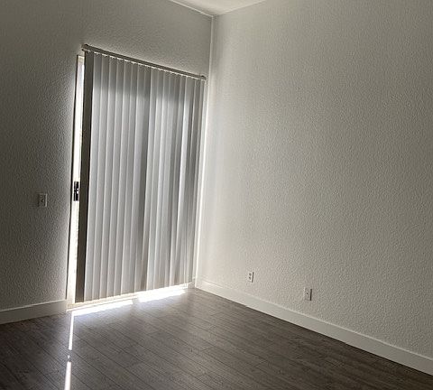 Master bedroom facing second balcony