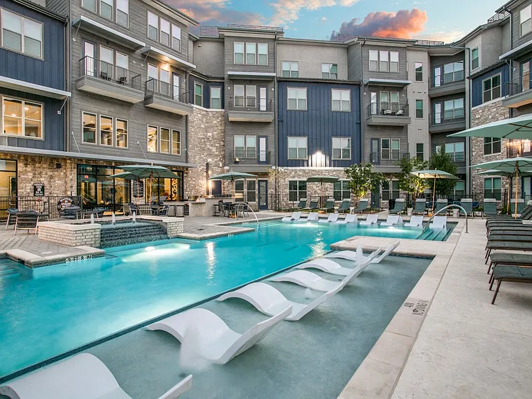 Resort-style pool with tanning ledge