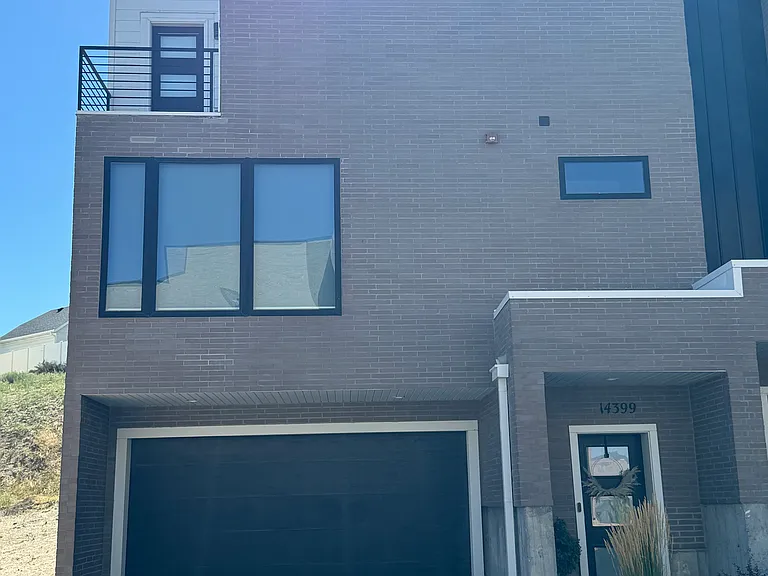 3 level modern townhome w/two car garage. Garage has 220V outlet for electric vehicle charging.