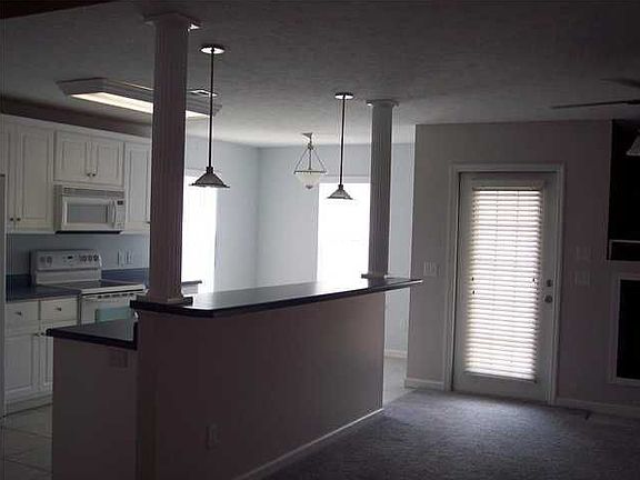 Open Kitchen with with Breakfast Nook and Bar! (Rooms repainted since photo)