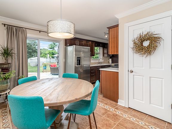 Dining Room with newer sliders out to deck and pool.