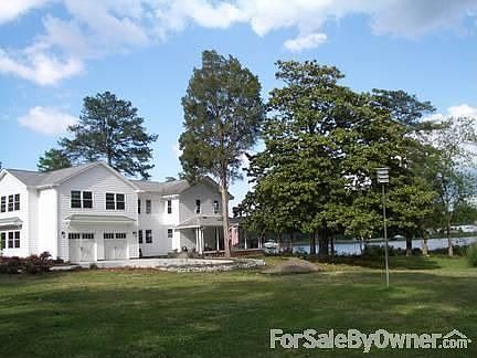 Majestic Magnolia & Tall Cedars
						:
						Mature trees frame flower and shrubbery beds while allowing vast river views.