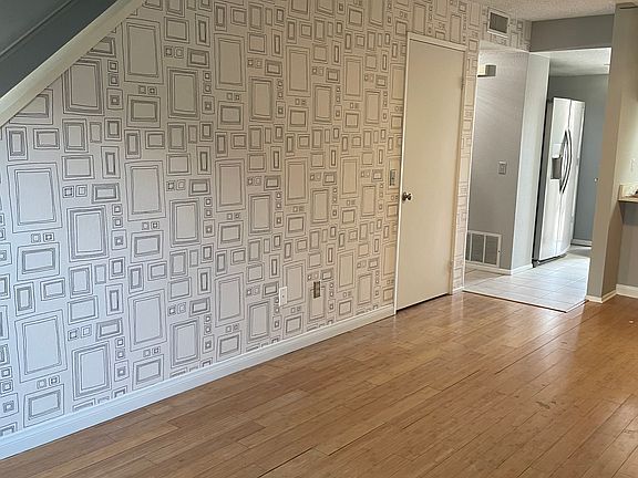 Front entry room. Custom wall paper.