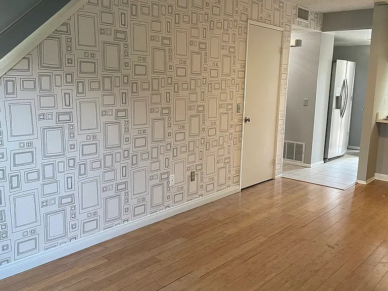 Front entry room. Custom wall paper.