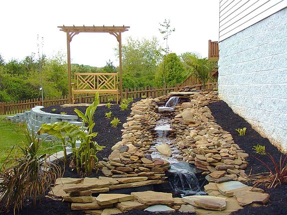 patio is next to the waterfall