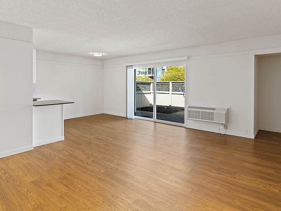 Living Room with Patio and Hard Surface Flooring