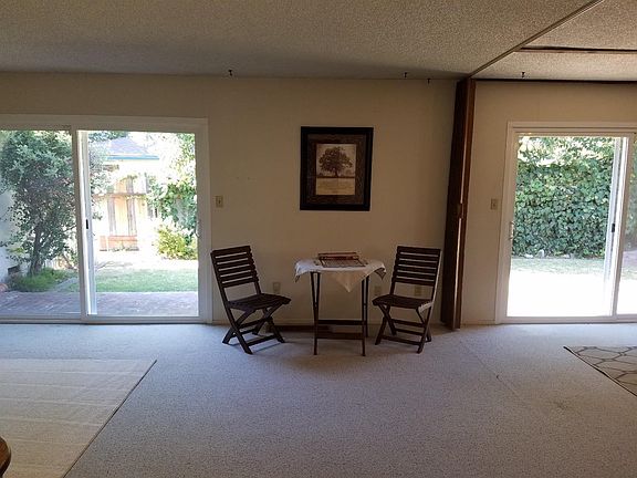 This large room has endless possibilities. Two sliding doors with access to the back yard.