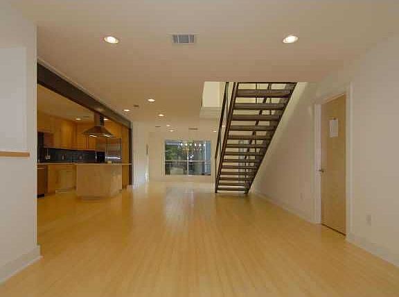 View from living area into dining.  Stunning bamboo floors throughout.