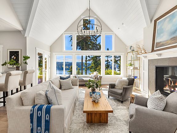 Luxurious yet comfortable living room with access to deck. 