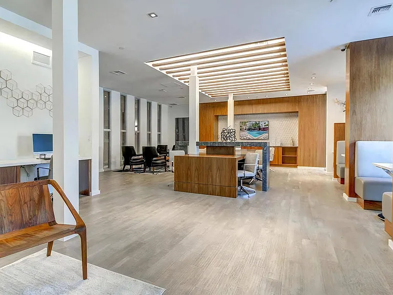 Resident Lounge with Booth Seating, Workstations, and TV Display