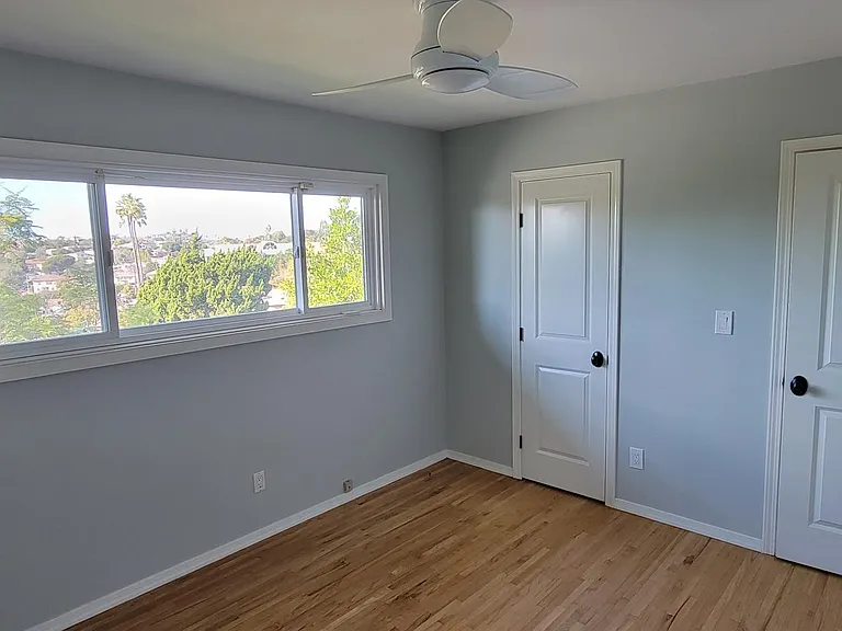 Guest Bedroom- ceiling fan. Big window
