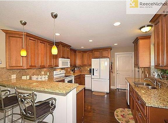 Real hardwood floors. Door to garage.