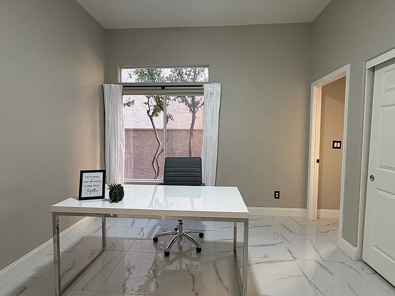 Private office with double doors and natural light