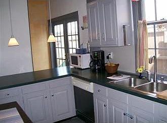 Updated Fireplaced Kitchen with French Doors to Patio