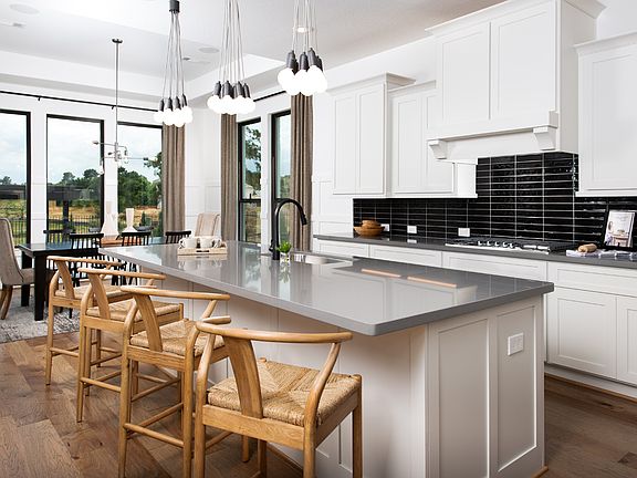 Well-designed kitchen is equipped with a large center island