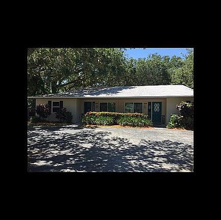 Front view of house and parking area driveway