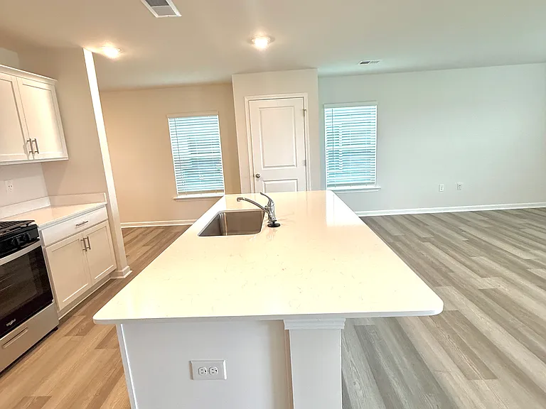 Large quartz kitchen island.