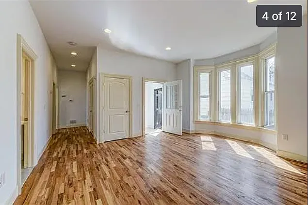 Large, spacious, bright and airy living room with bay windows