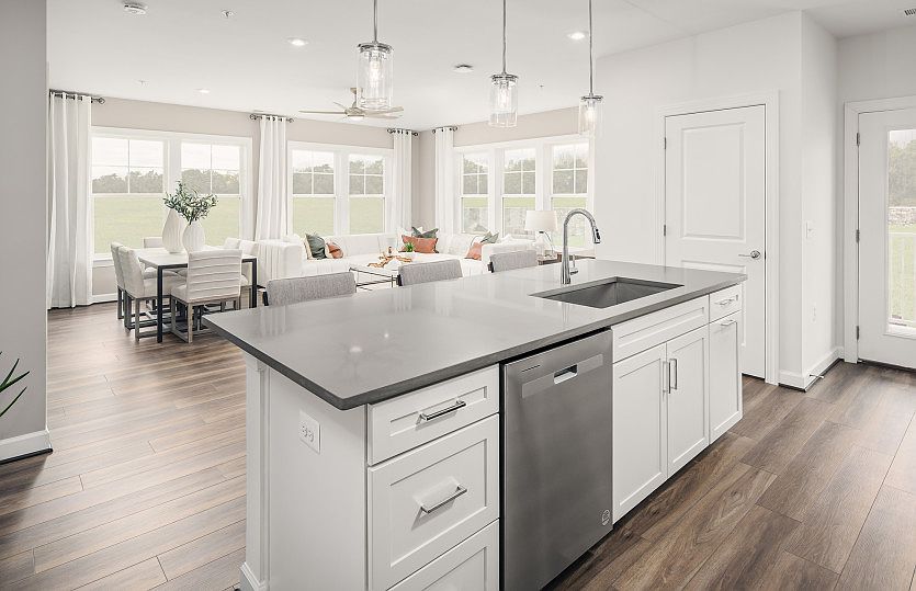 Kitchen Overlooks Dining Room and Living Room