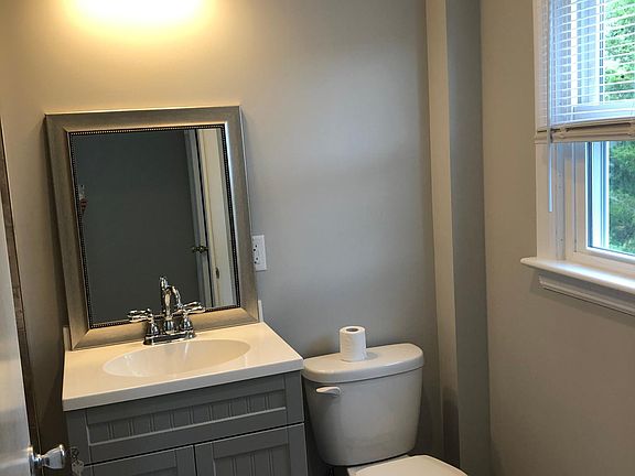 Full bath with tile floor and shower.