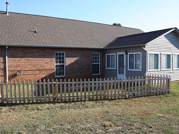 Back of Home with sunroom