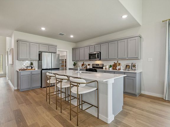 Kitchen in the Winters home plan by Trophy Signature Homes - REPRESENTATIVE PHOTO