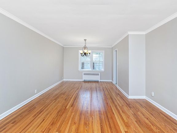 Hardwood floors newly refinished and fresh paint with neutra
