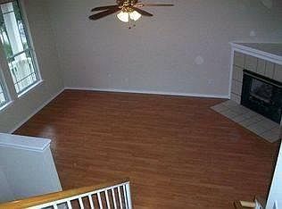Living room looking from the stairway to the second floor.
