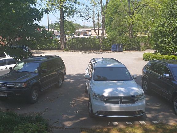 Private parking in rear seen from small back porch