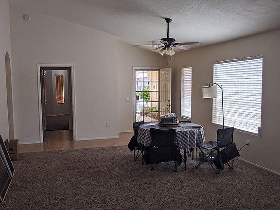 Living room / dining facing front door.