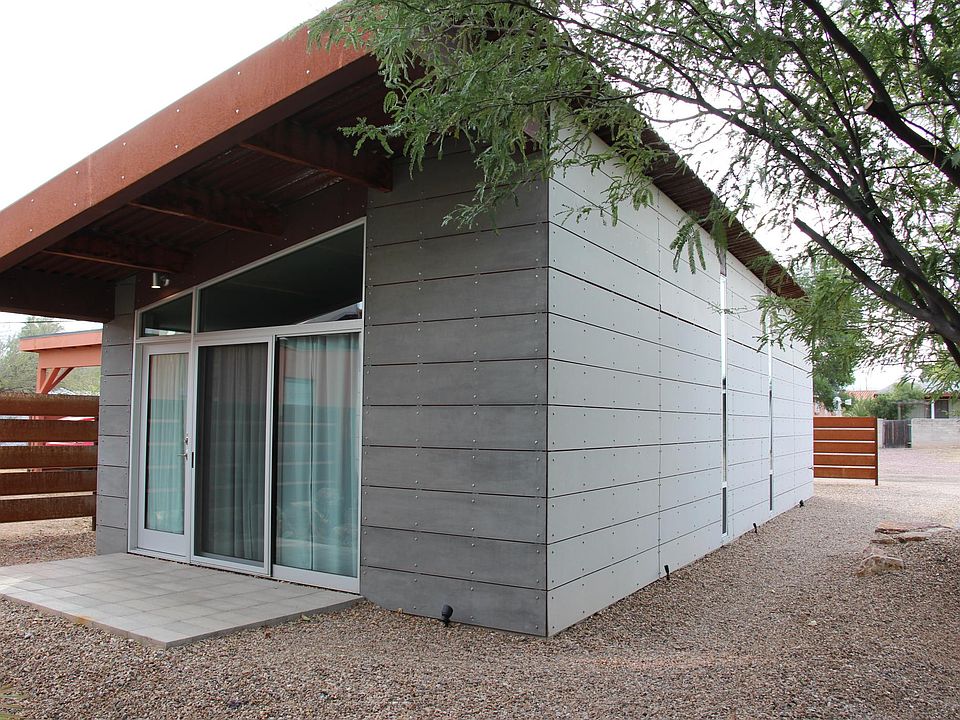 Front door, parking to the west off of the alley