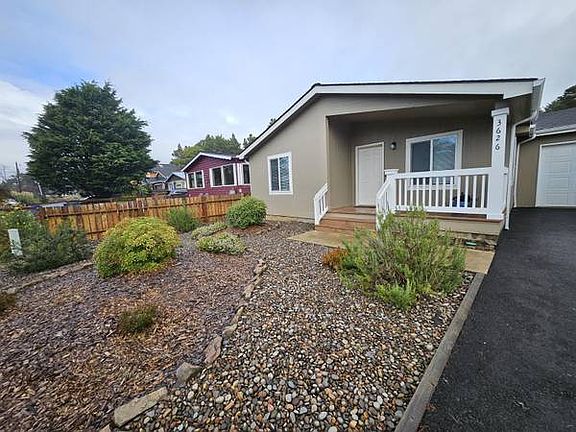 Home is landscaped with native plants that require no upkeep.