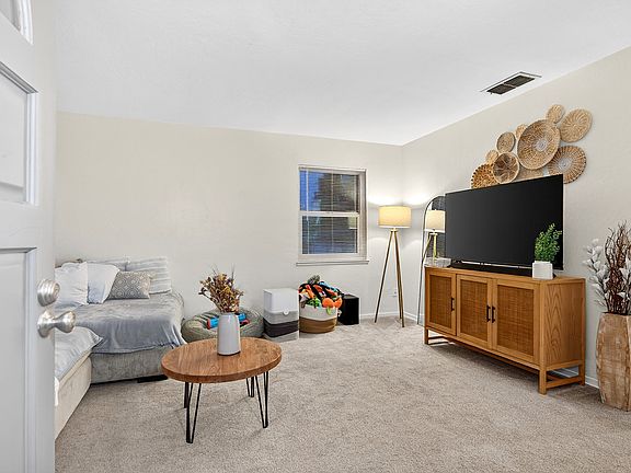 Living room with furniture (example only; not furnished)