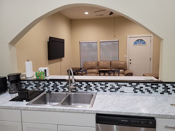 Kitchen facing out towards living room