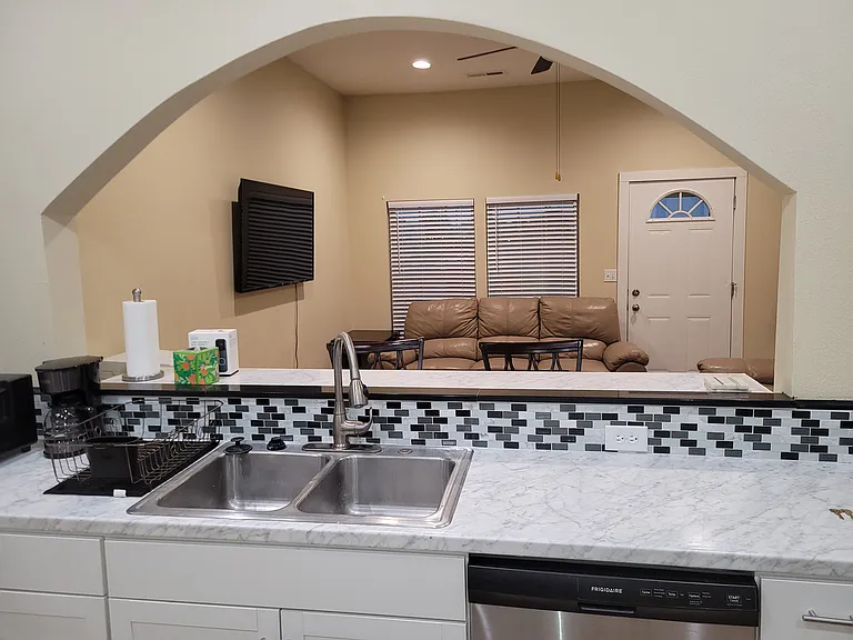 Kitchen facing out towards living room