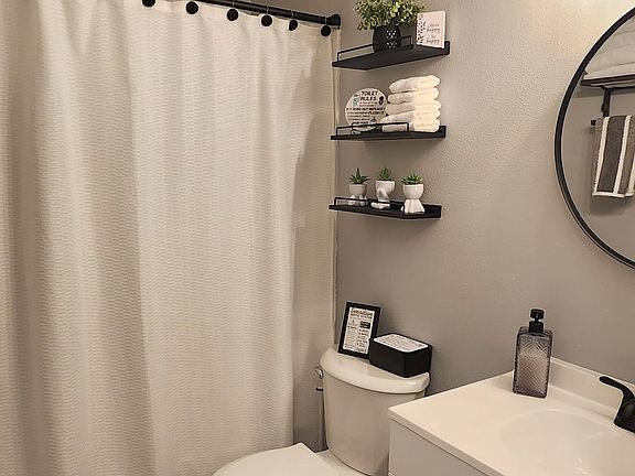 Shared bathroom with one other room.