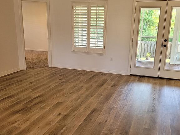 French doors from the living room to the large screened porch