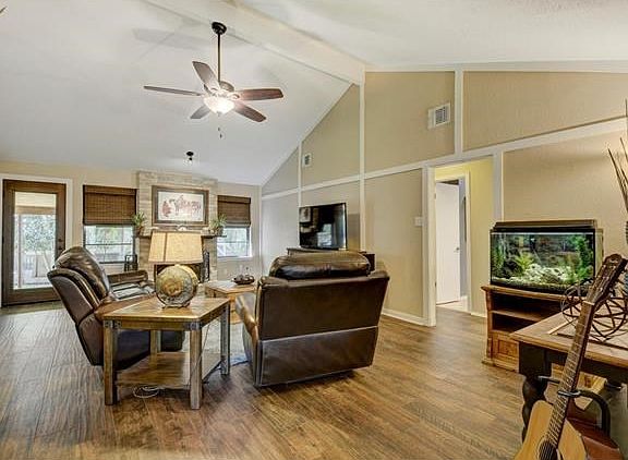Large family room with new wood-scraped tile floors