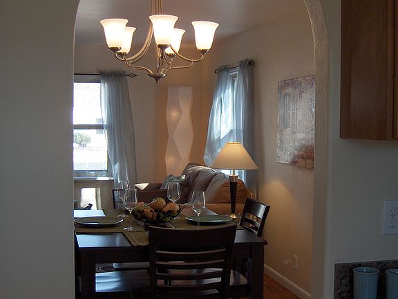Arched doorway between kitchen and dining area.  