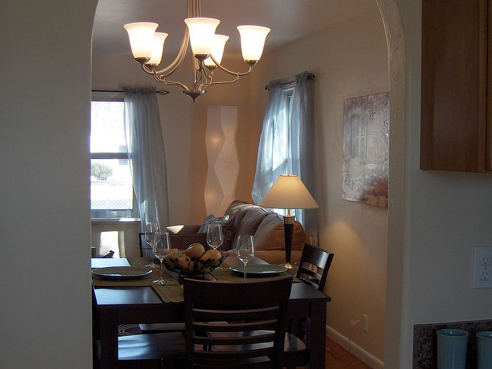 Arched doorway between kitchen and dining area.  