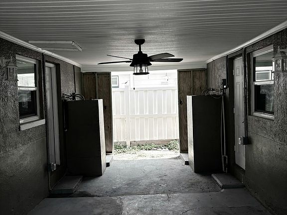 Nice area in breezeway even has ceiling fan for added comfort.