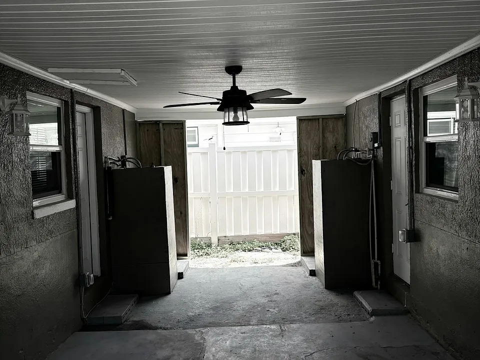 Nice area in breezeway even has ceiling fan for added comfort.