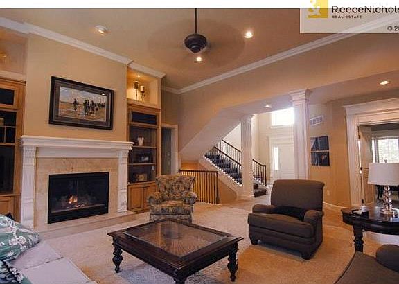 Crown molding, custom woodwork, gas fireplace, built-ins throughout